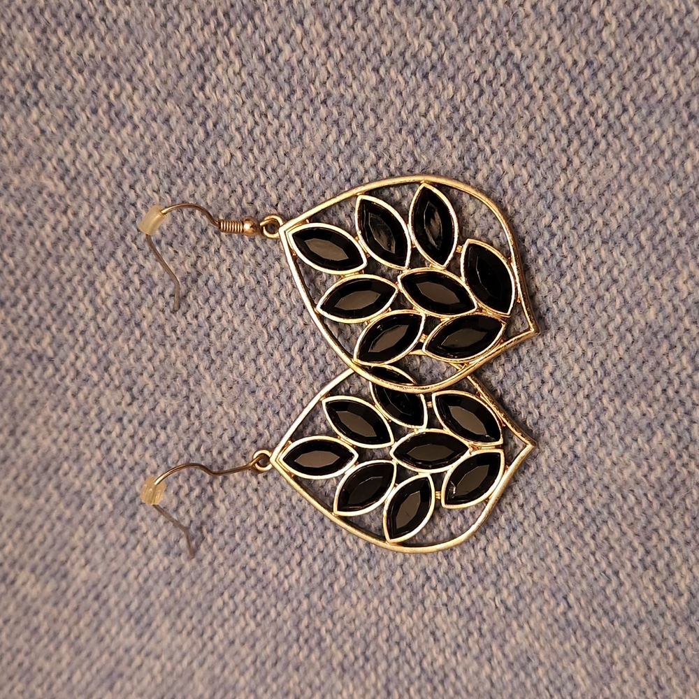 Gold toned dangle earrings with black sparkly gems